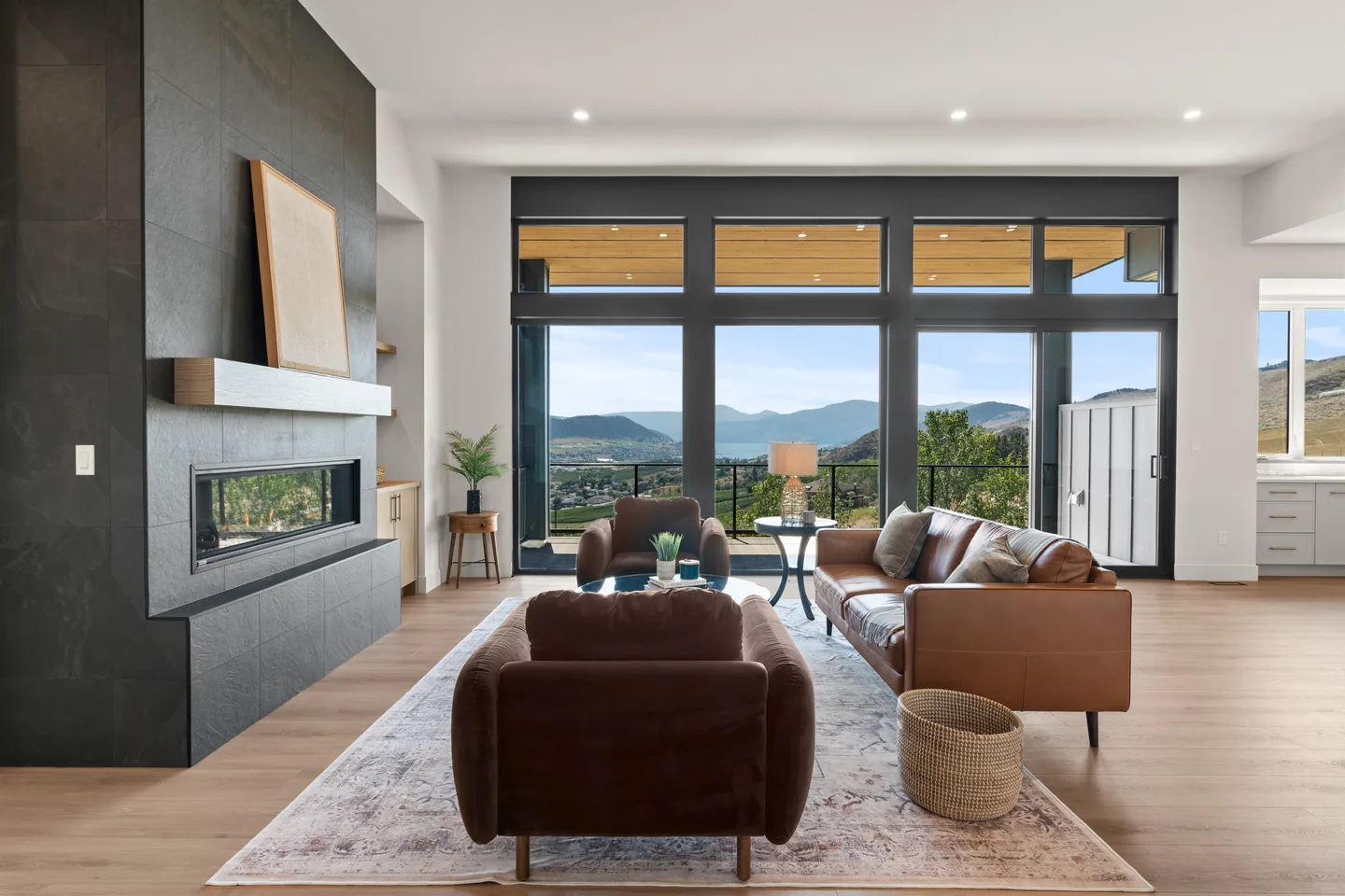 Great room with linear fireplace and valley views